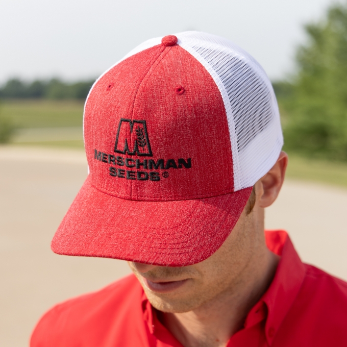 Man wearing a Red & White Merschman Seeds Hat