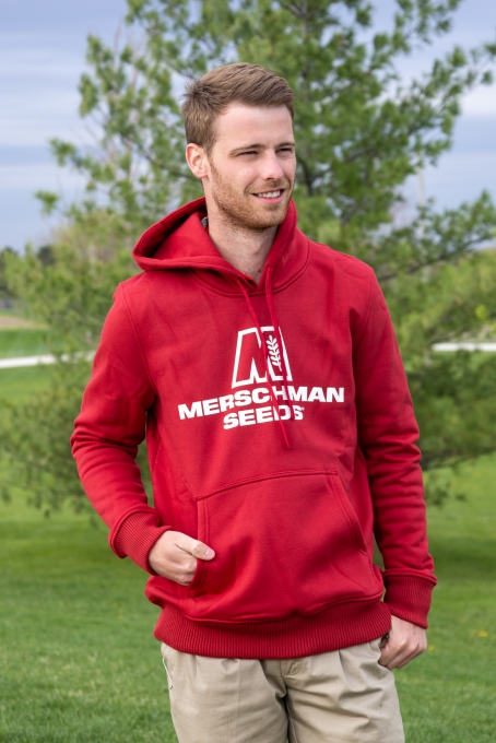 Man wearing red Merschman Seeds Sweater